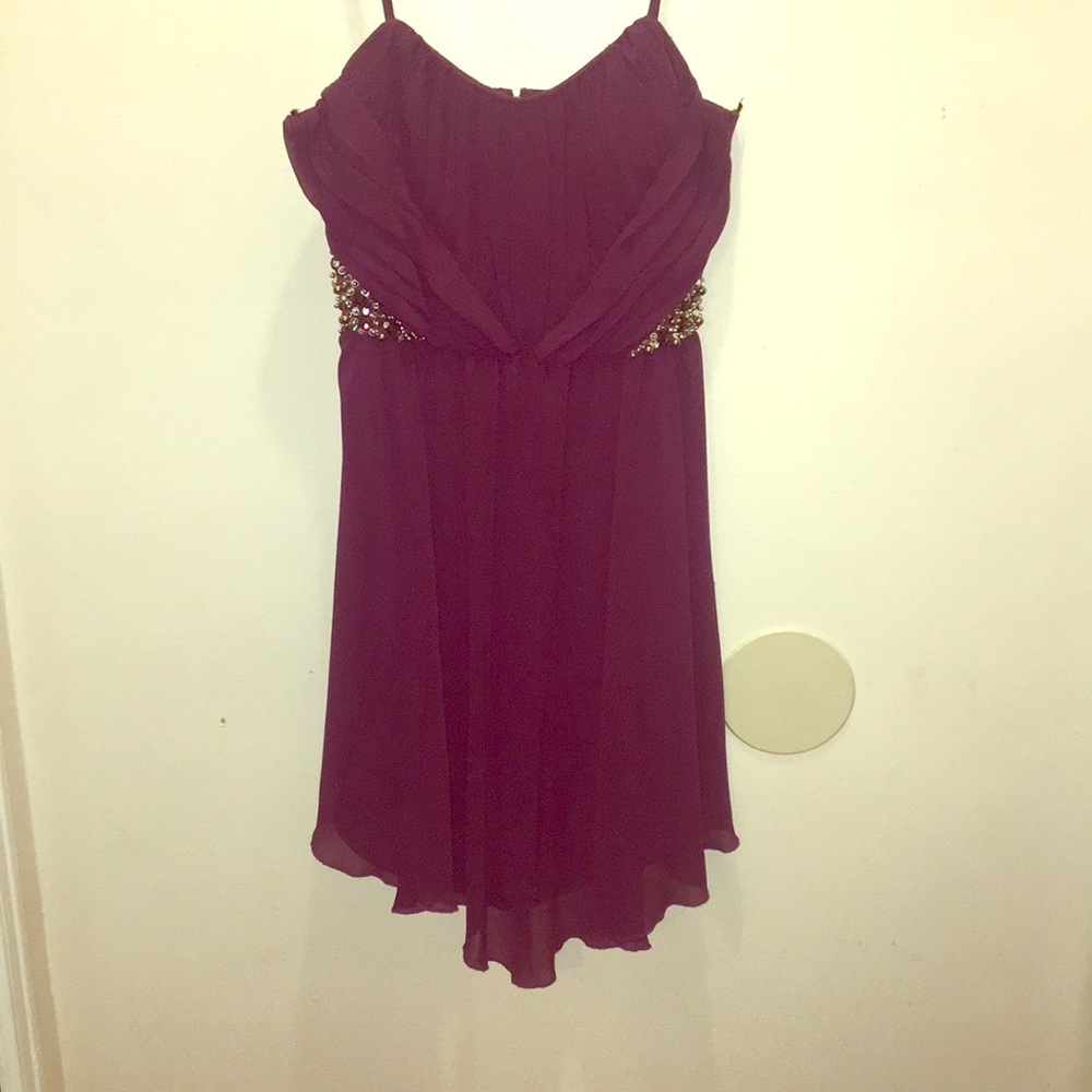 Purple short skirt.